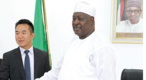 Managing Director of Huawei in Nigeria, Teng Li (L) and the secretary to the Nigerian government, Babachir David Lawal (R) at the signing of the Memorandum of Understanding in Abuja